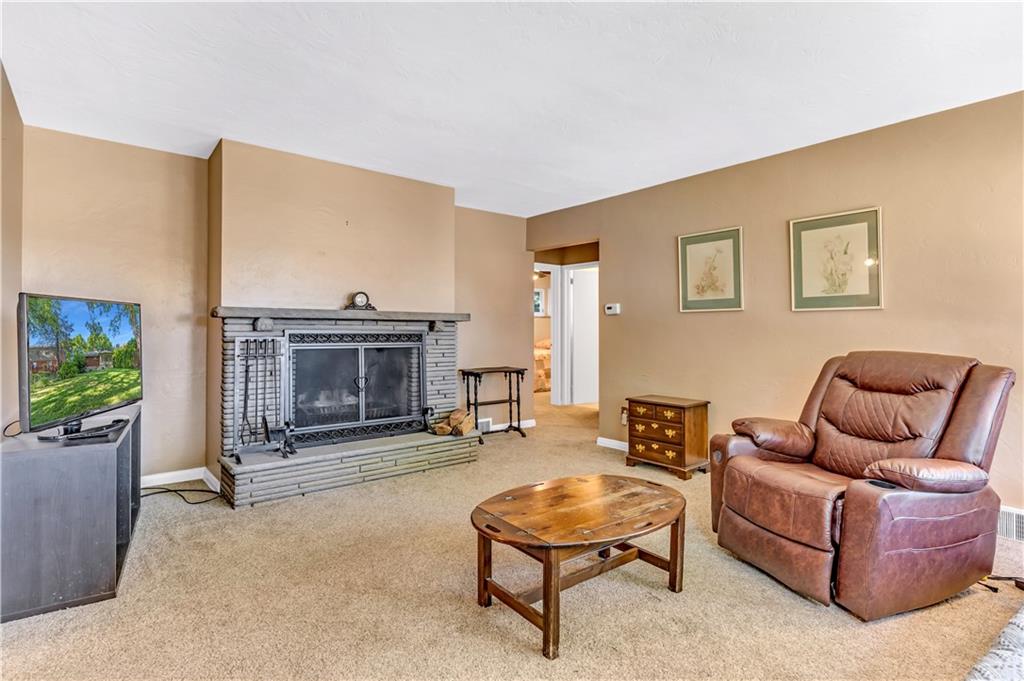 434 Summit Drive Pittsburgh, PA 15228 - Photo 4 of 24 a living room with furniture and a fireplace
