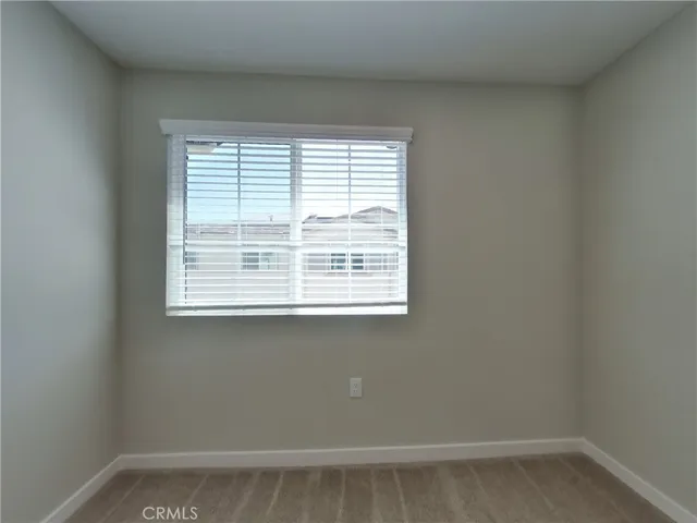 an empty room with closet area
