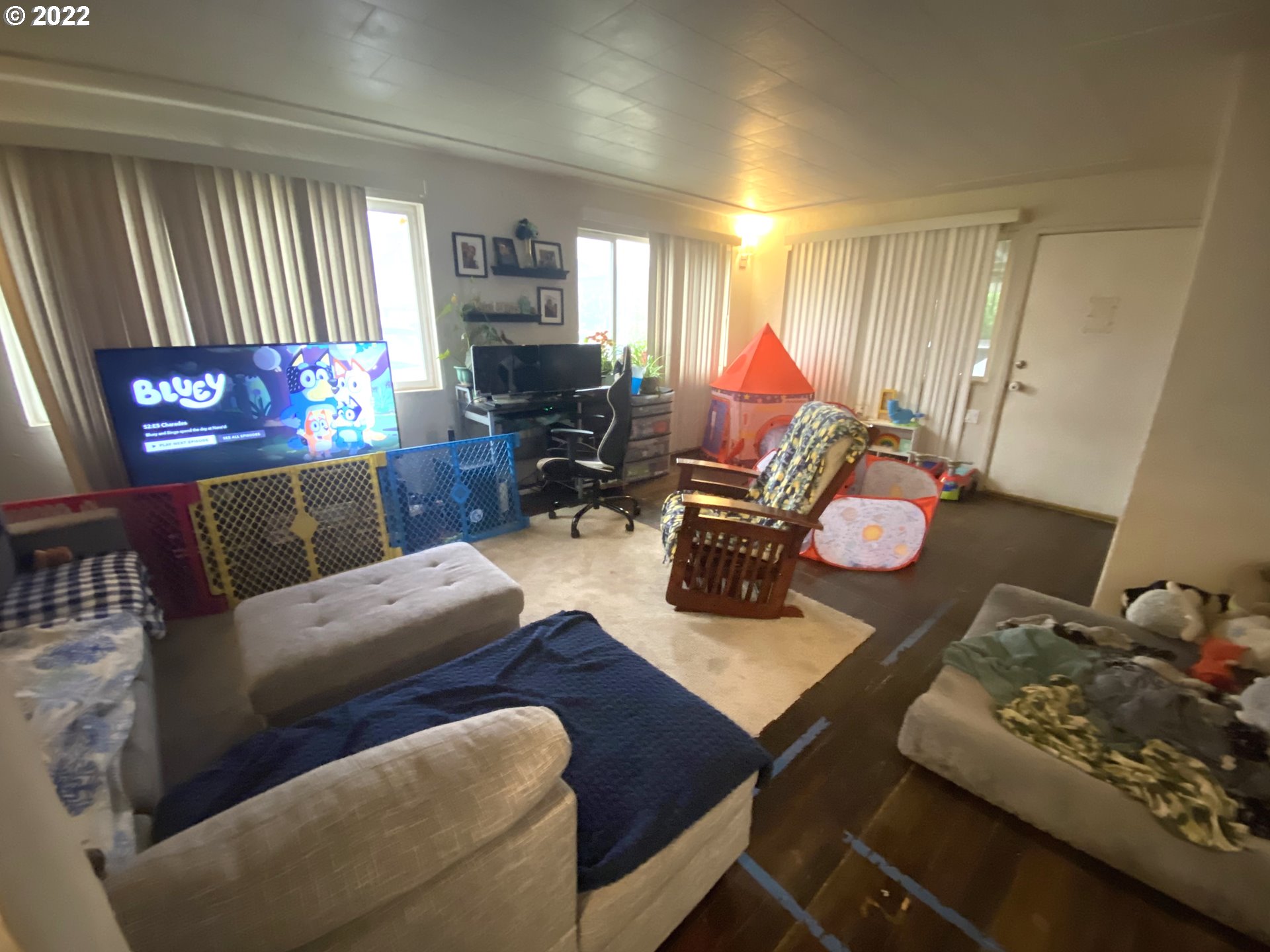 5560 A Street Springfield, OR 97478 - Photo 3 of 21 a living room with furniture and a flat screen tv
