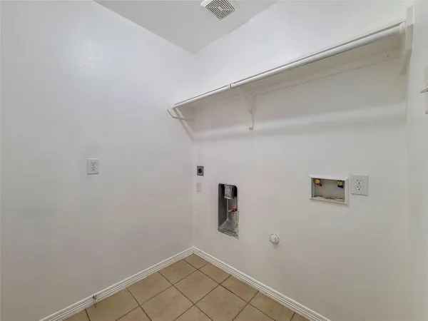 a view of a storage & utility room with a window