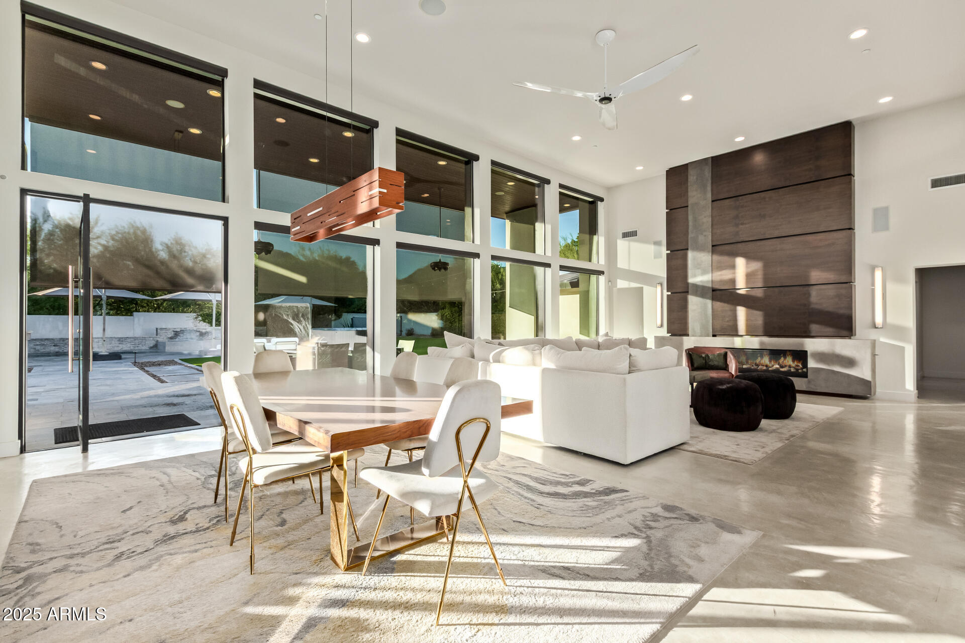 6636 North 48th Street Paradise Valley, AZ 85253 - Photo 13 of 54 a dining hall with stainless steel appliances kitchen island granite countertop a table and chairs