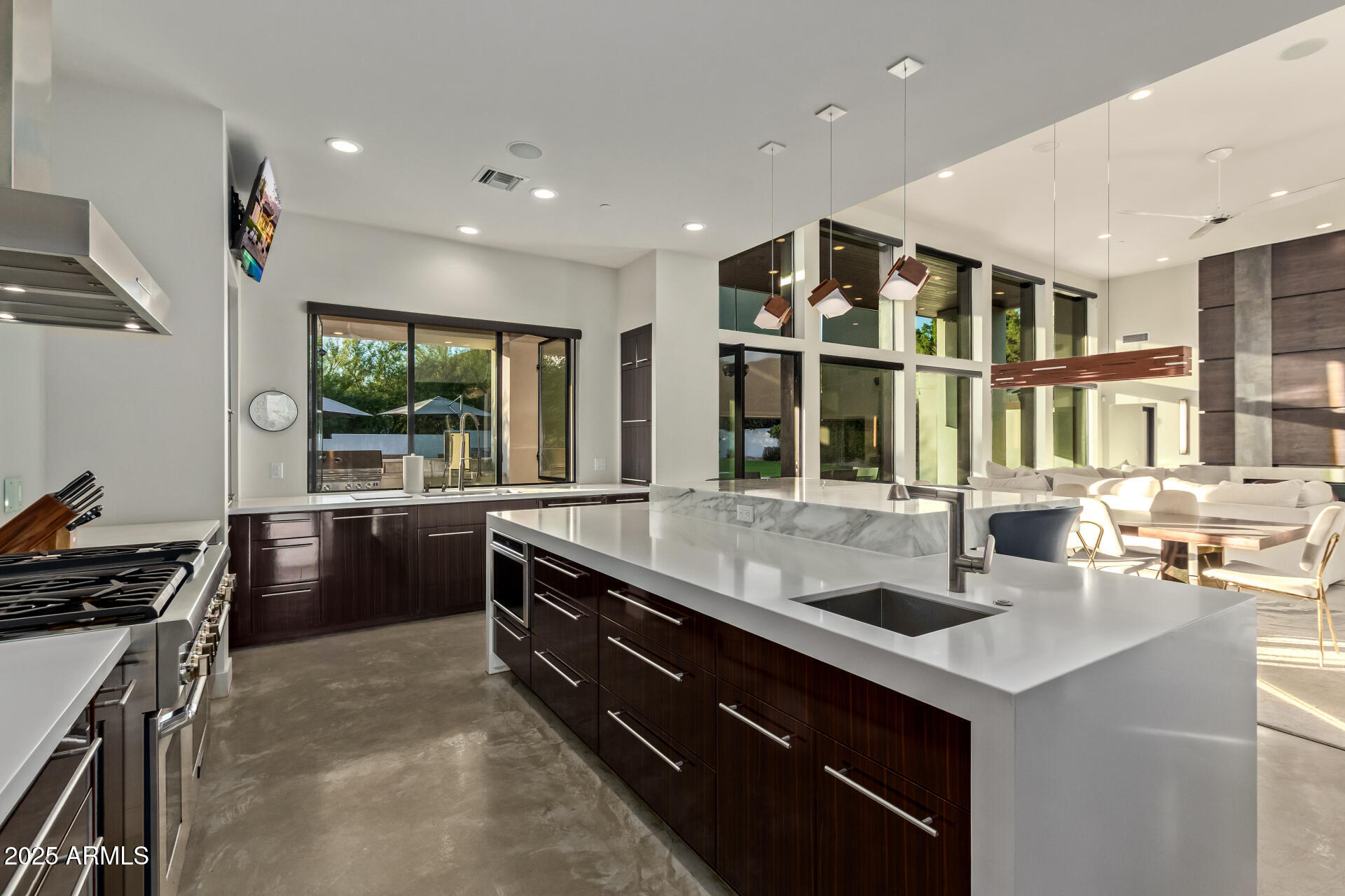 6636 North 48th Street Paradise Valley, AZ 85253 - Photo 16 of 54 a kitchen with stainless steel appliances granite countertop a sink and a stove