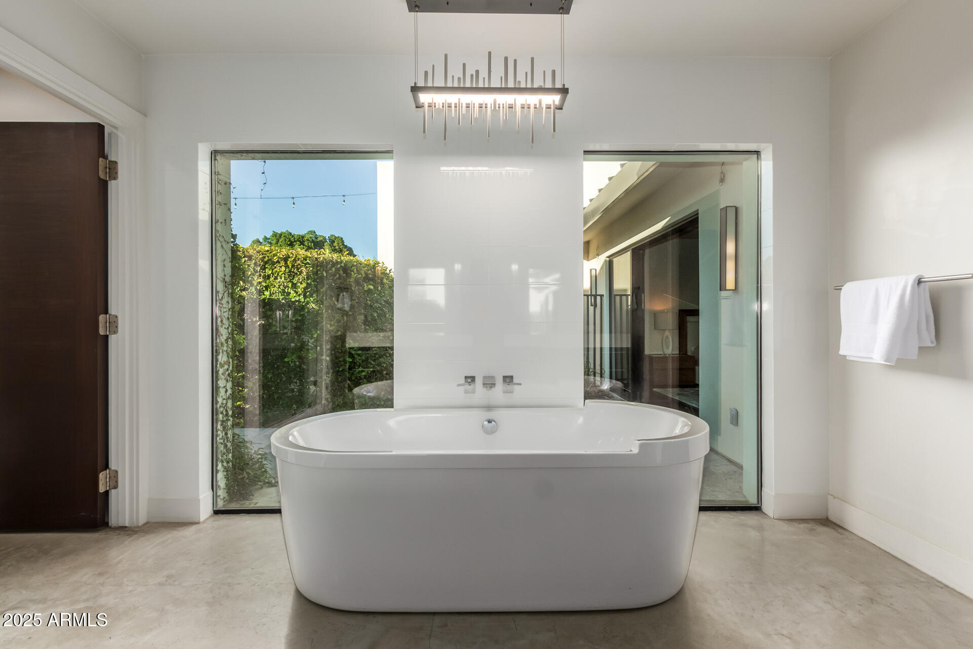 6636 North 48th Street Paradise Valley, AZ 85253 - Photo 24 of 54 a white bath tub sitting in a bathroom