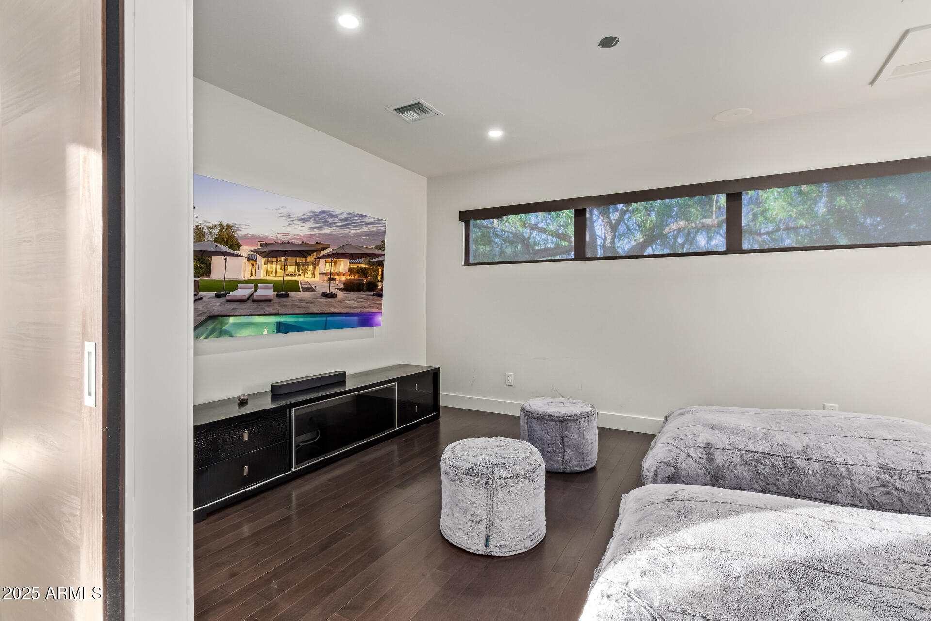 6636 North 48th Street Paradise Valley, AZ 85253 - Photo 31 of 54 a living room with furniture and a flat screen tv