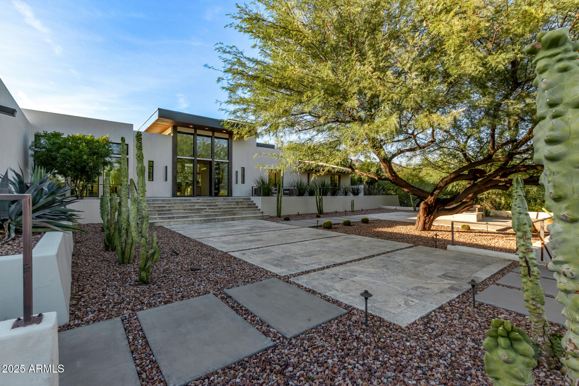 6636 North 48th Street Paradise Valley, AZ 85253 - Photo 4 of 54 a view of a patio with table and chairs and potted plants