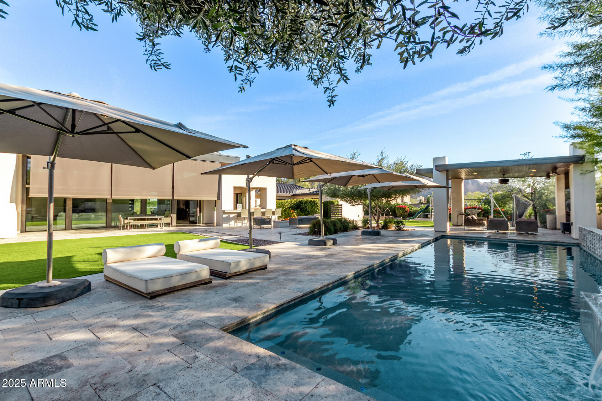 6636 North 48th Street Paradise Valley, AZ 85253 - Photo 43 of 54 a view of a swimming pool with a patio