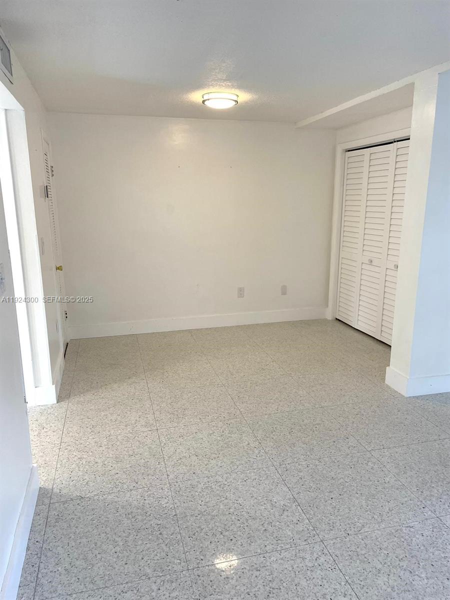6424 Collins Avenue, Unit 204 Miami Beach, FL 33141 - Photo 7 of 21 an empty room with a window