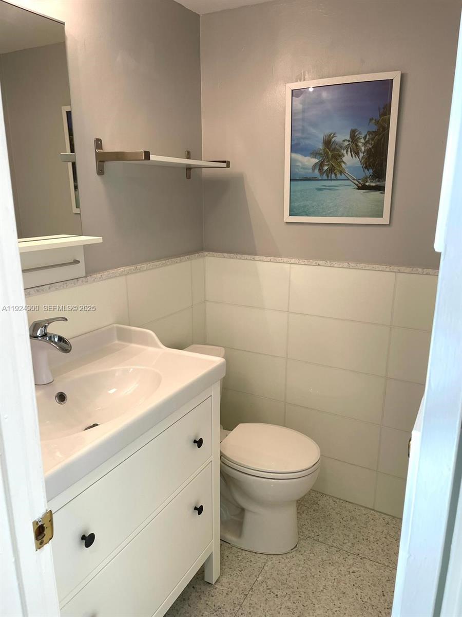 6424 Collins Avenue, Unit 204 Miami Beach, FL 33141 - Photo 10 of 21 a bathroom with a toilet and a sink