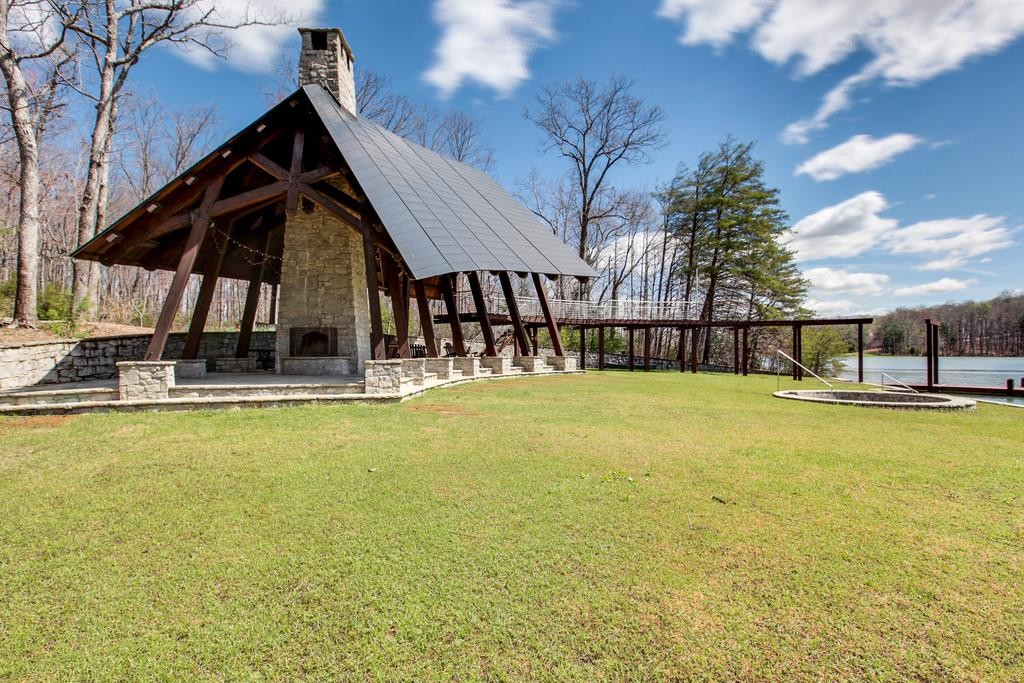 7 Long Mountain Road McMinnville, TN 37110 - Photo 12 of 62 a view of a swimming pool with a garden and plants