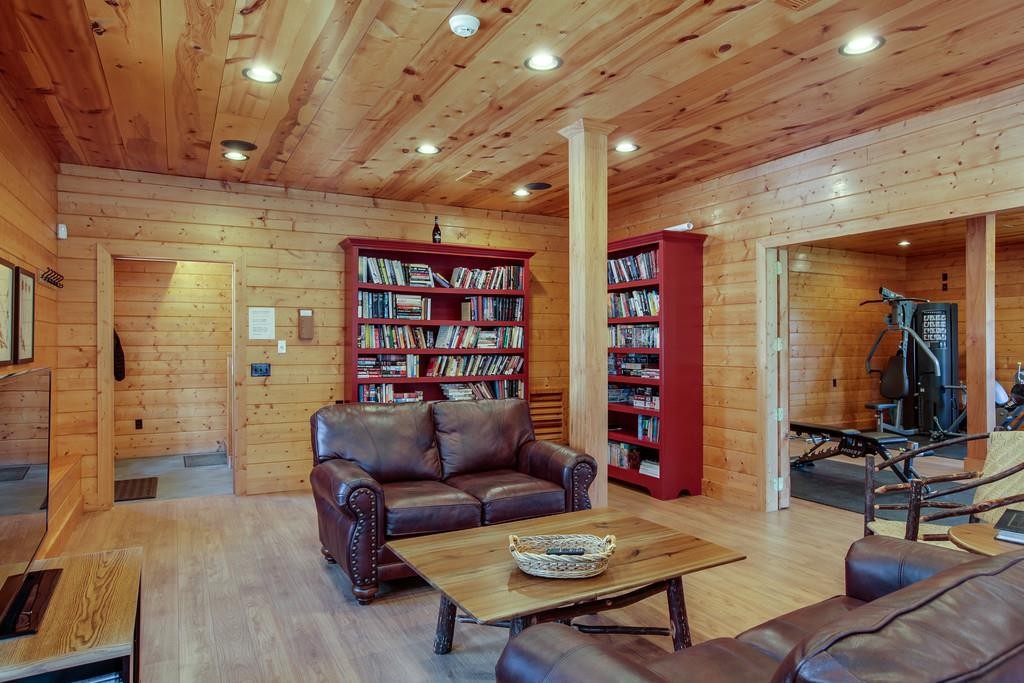 7 Long Mountain Road McMinnville, TN 37110 - Photo 22 of 62 a living room with furniture a rug and a chandelier