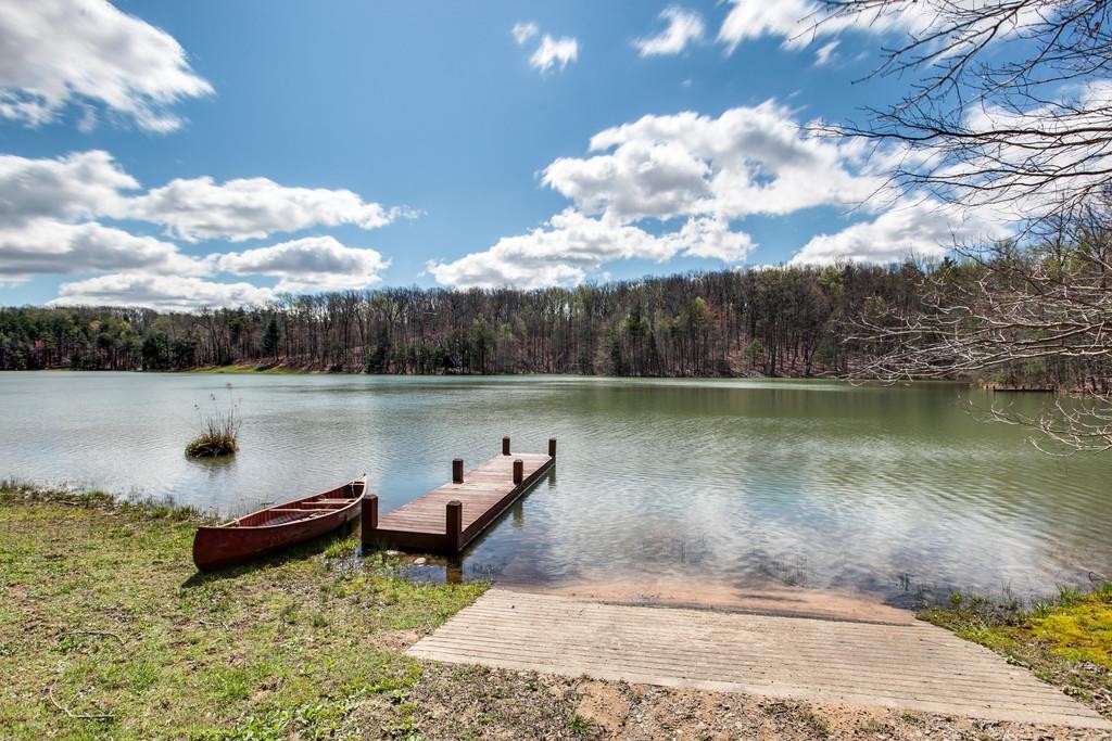 7 Long Mountain Road McMinnville, TN 37110 - Photo 4 of 62 a backyard of a house with lots of green space and lake view