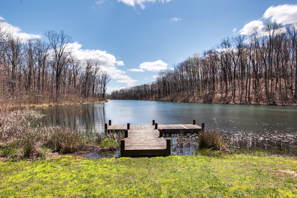 7 Long Mountain Road McMinnville, TN 37110 - Photo 45 of 62 a view of a lake with a house in the background