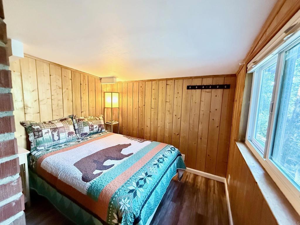 22292 Crestline Road Palomar Mountain, CA 92060 - Photo 12 of 38 a bedroom with a bed and a window