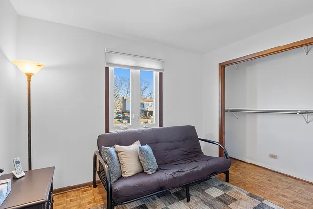 a living room with a couch and a window