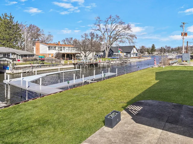 a view of a swimming pool with a lawn chairs