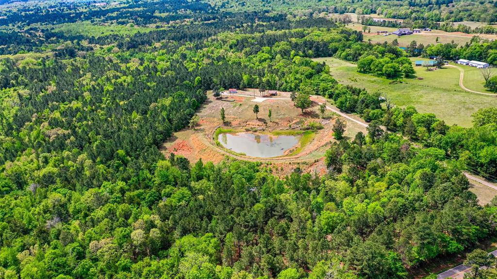 11088 County Road 334 Tyler, TX 75708 - Photo 23 of 23 an aerial view of a house with a yard and lake