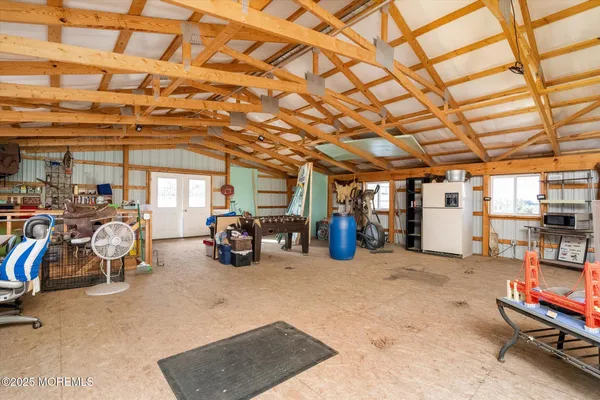 a view of a house with a yard and a garage