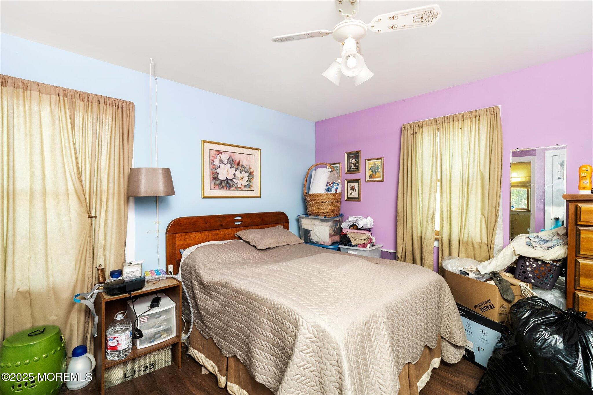 537 Chesterfield Arneytown Road Chesterfield, NJ 08515 - Photo 39 of 89 a bedroom with a bed and a chandelier