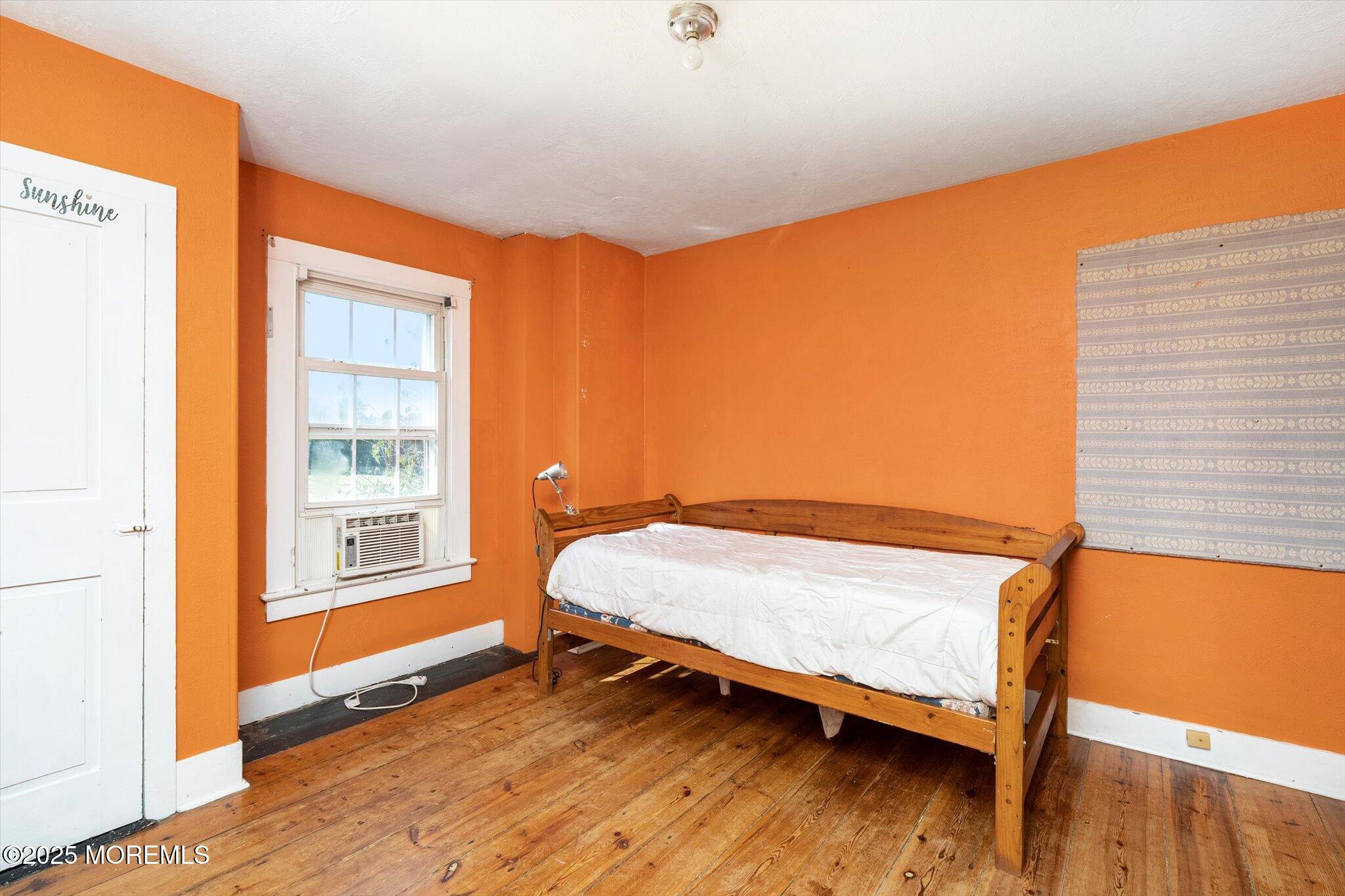 537 Chesterfield Arneytown Road Chesterfield, NJ 08515 - Photo 49 of 89 a bedroom with a bed and wooden floor