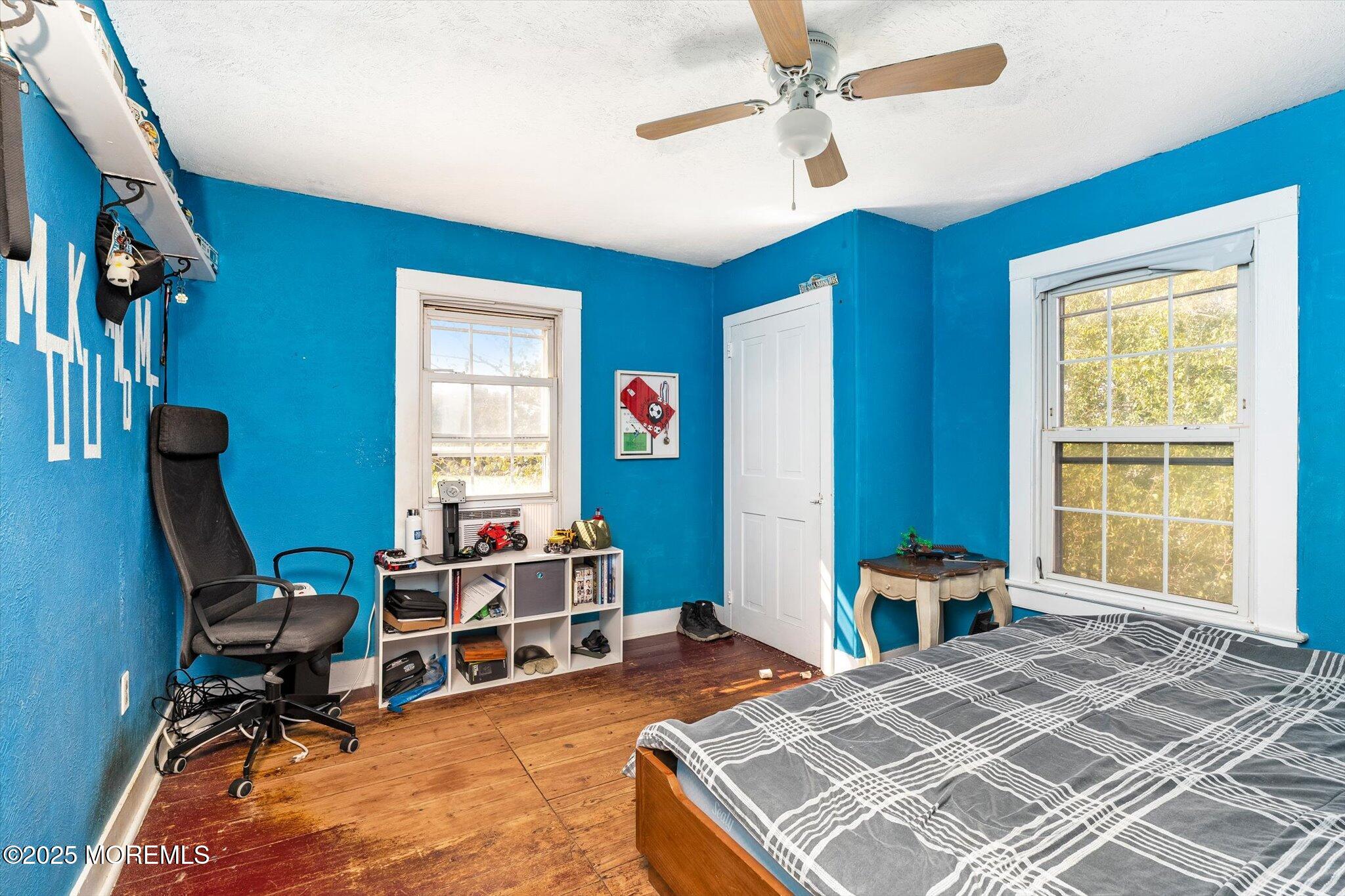 537 Chesterfield Arneytown Road Chesterfield, NJ 08515 - Photo 52 of 89 a bedroom with a bed a table and a chandelier