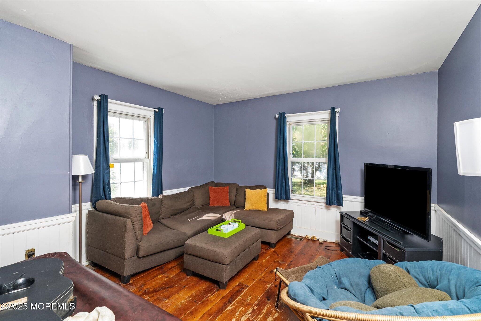 537 Chesterfield Arneytown Road Chesterfield, NJ 08515 - Photo 60 of 89 a living room with furniture and a flat screen tv