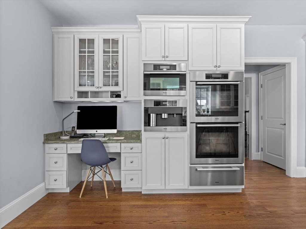 81 Fuller Street Newton, MA 02465 - Photo 13 of 42 a view of kitchen with microwave stove cabinets and wooden floor