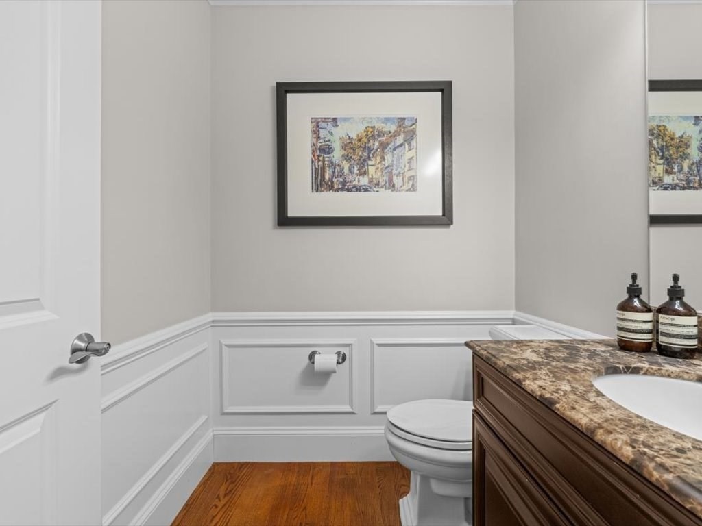 81 Fuller Street Newton, MA 02465 - Photo 16 of 42 a bathroom with a granite countertop toilet sink and mirror