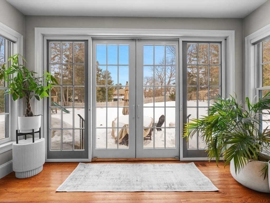 81 Fuller Street Newton, MA 02465 - Photo 17 of 42 a view of an entryway with wooden floor and a potted plant