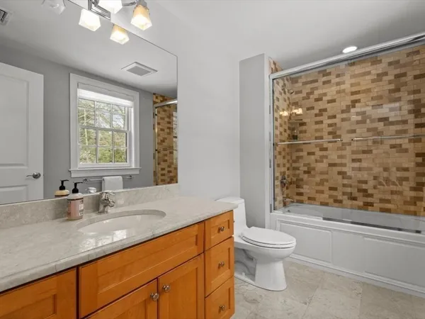 a bathroom with a sink a vanity and a mirror