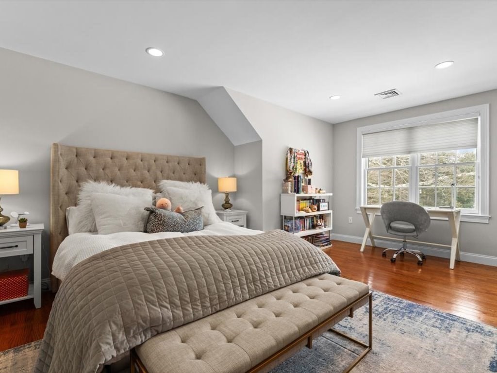 81 Fuller Street Newton, MA 02465 - Photo 30 of 42 a bedroom with a bed couch and wooden floor