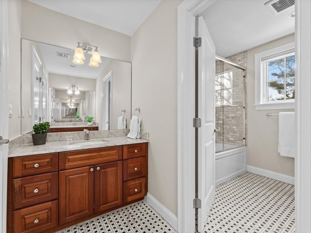 81 Fuller Street Newton, MA 02465 - Photo 31 of 42 a bathroom with a sink a vanity and a mirror