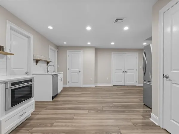 a view of a chairs and table in the patio
