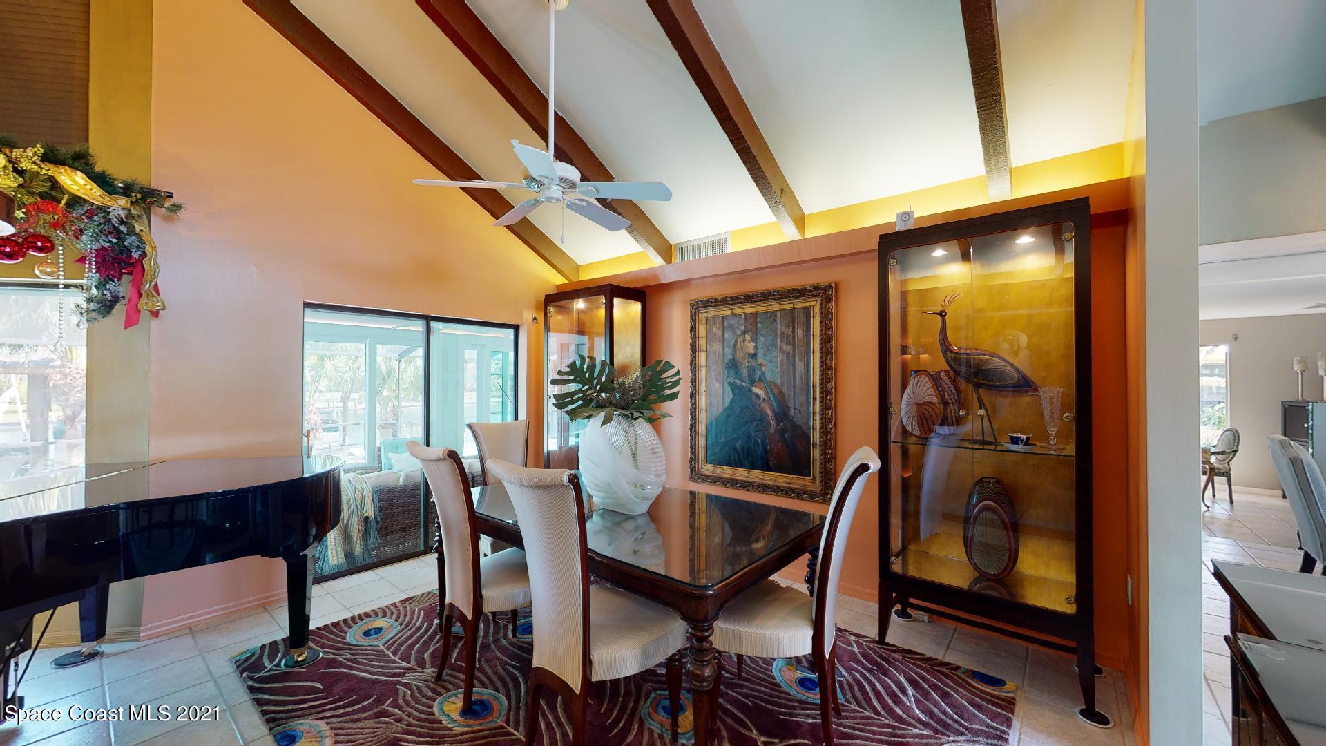 61 Country Club Road Cocoa Beach, FL 32931 - Photo 14 of 100 a dining room with furniture and window