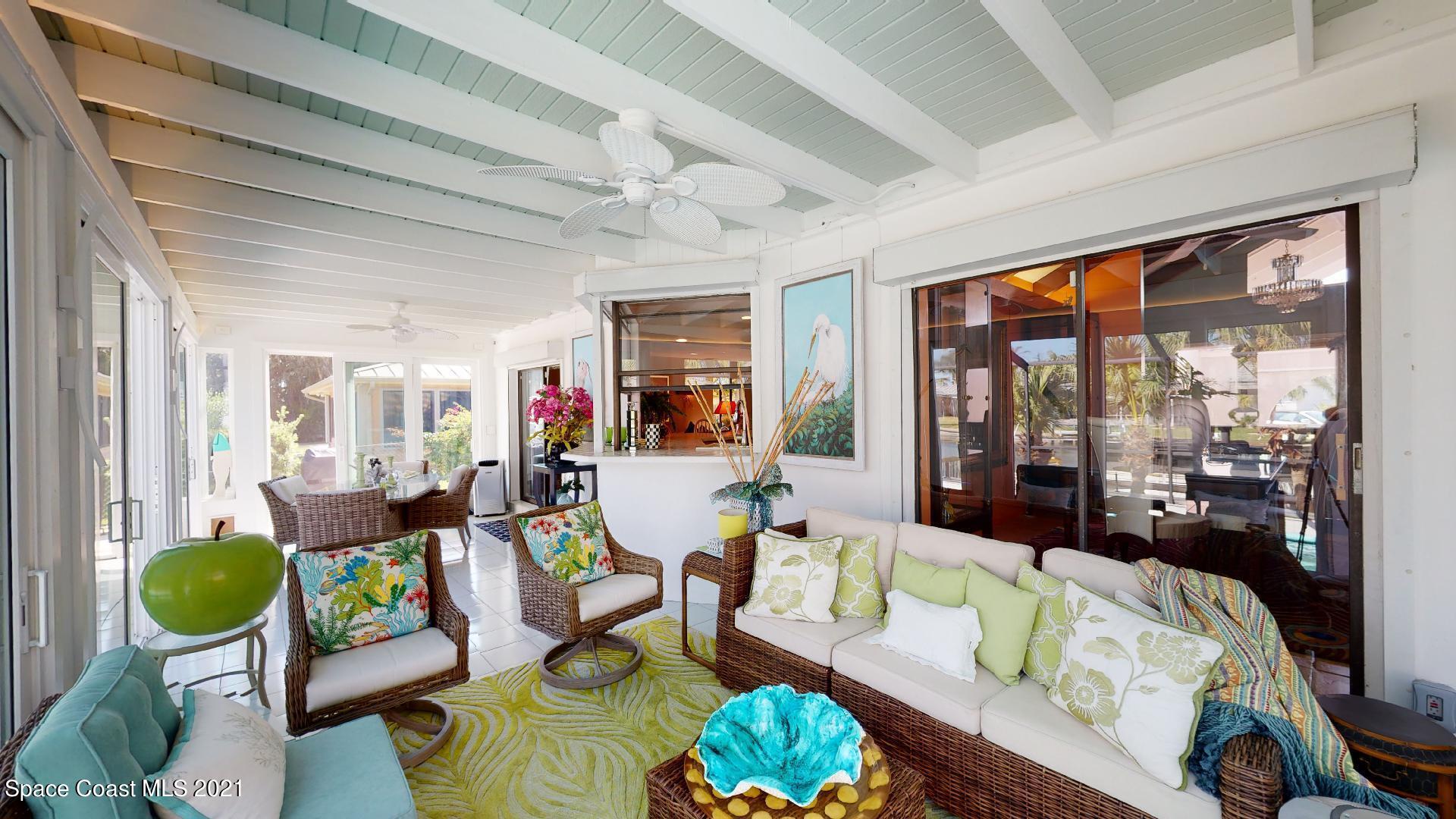 61 Country Club Road Cocoa Beach, FL 32931 - Photo 36 of 100 a living room with furniture and a large window