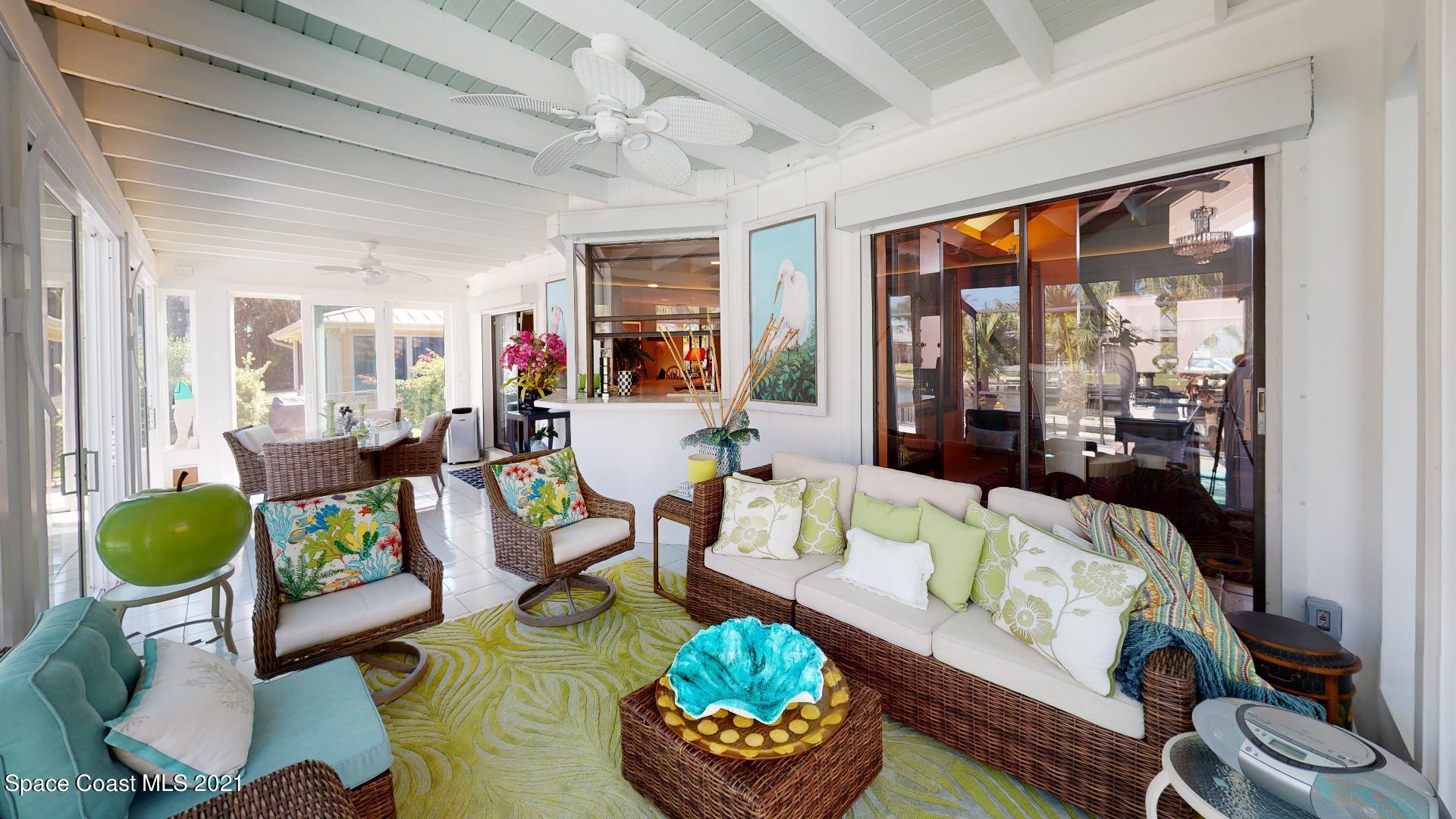 61 Country Club Road Cocoa Beach, FL 32931 - Photo 73 of 100 a living room with furniture and a large window