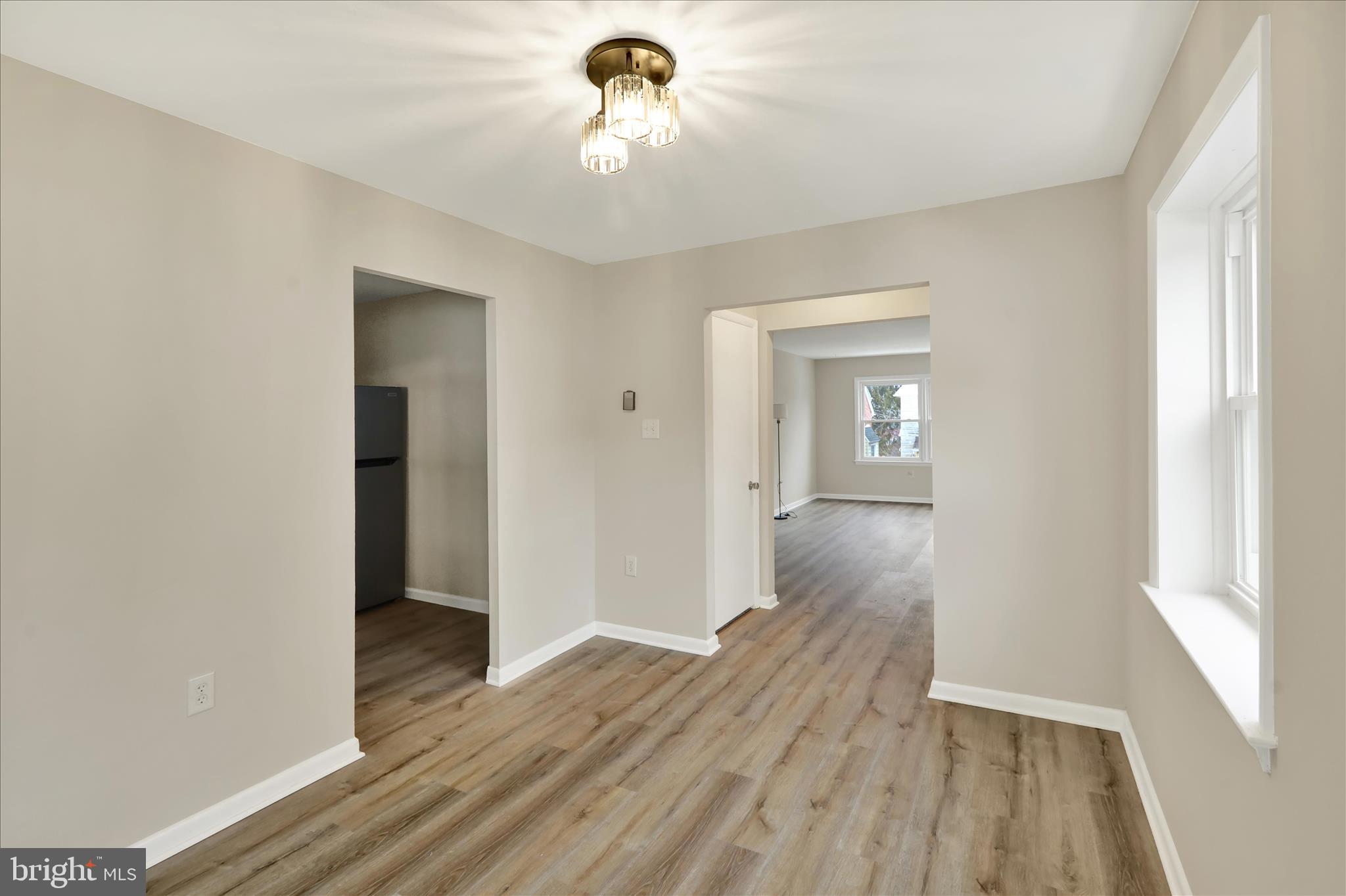 2560 Grant Street Reading, PA 19606 - Photo 11 of 30 a view of a hallway with wooden floor and a window