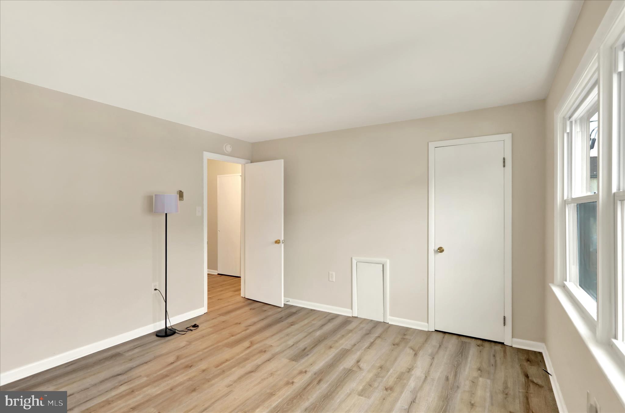 2560 Grant Street Reading, PA 19606 - Photo 15 of 30 an empty room with wooden floor and windows