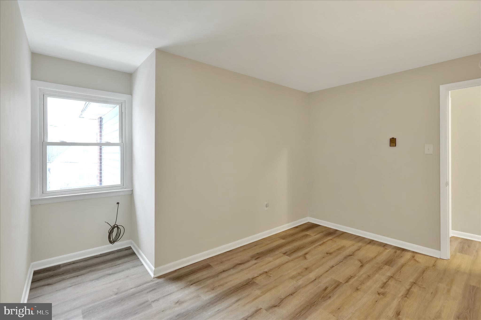 2560 Grant Street Reading, PA 19606 - Photo 18 of 30 an empty room with wooden floor and windows