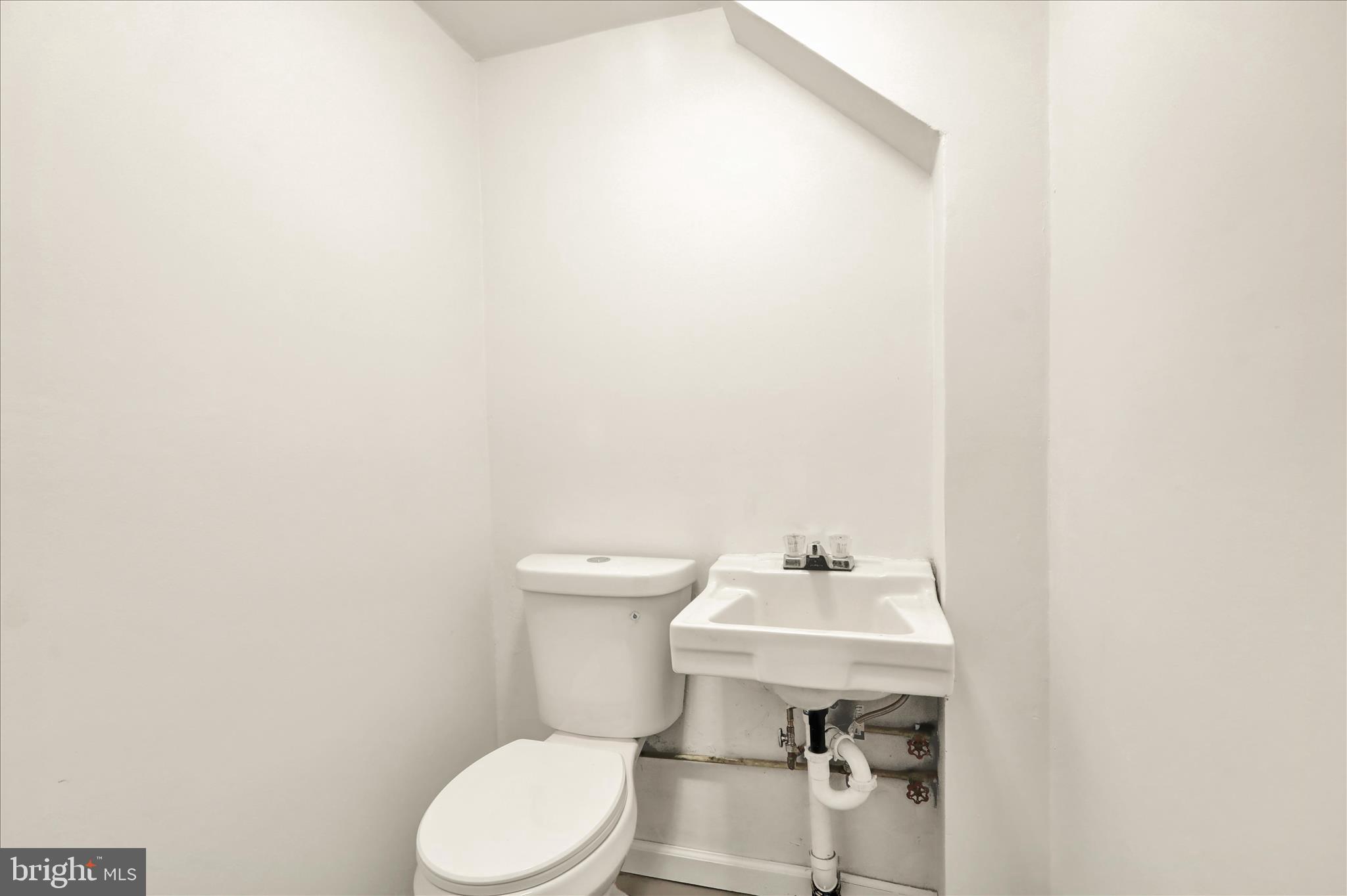 2560 Grant Street Reading, PA 19606 - Photo 23 of 30 a white toilet sitting next to a white sink