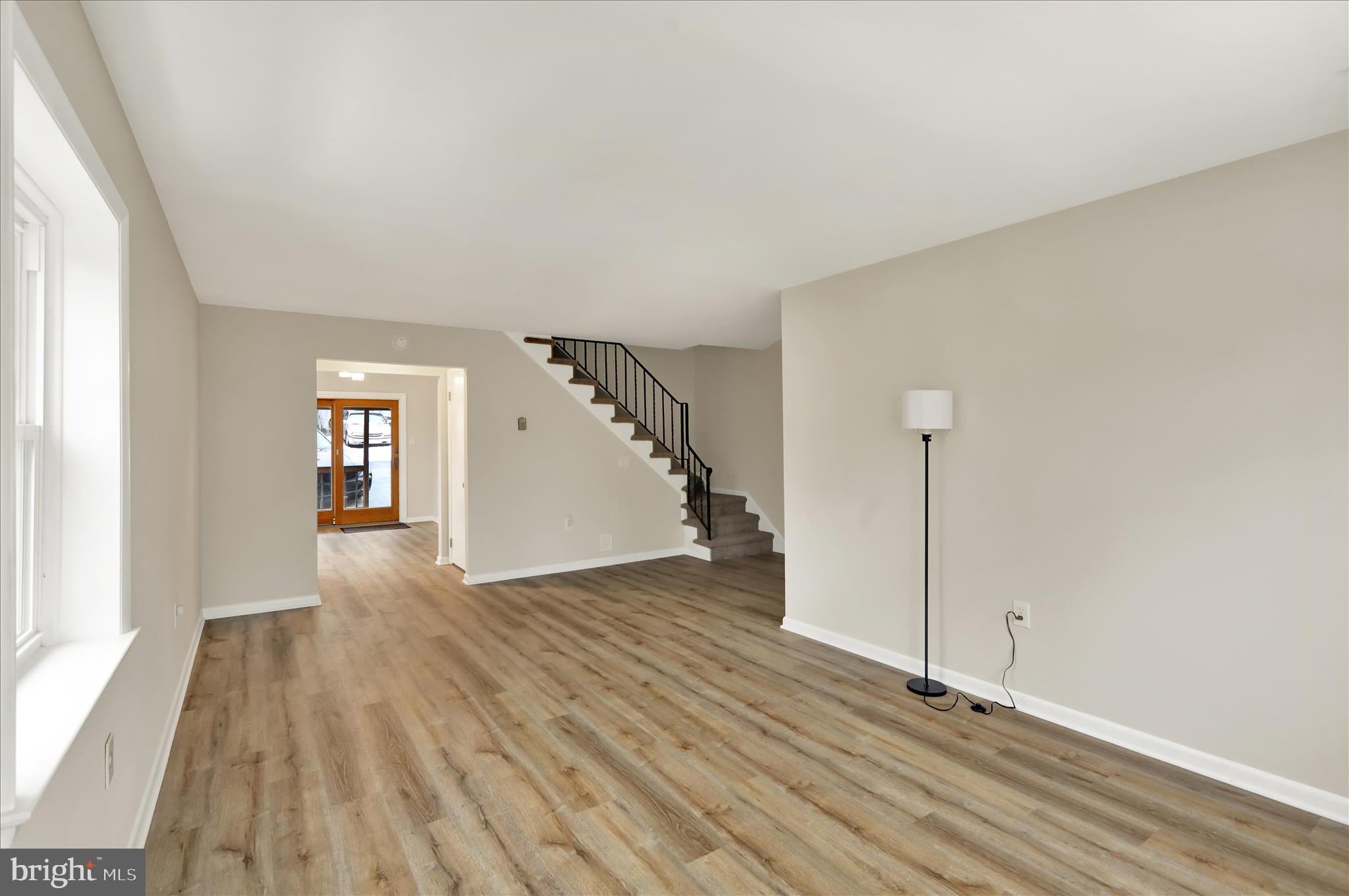 2560 Grant Street Reading, PA 19606 - Photo 9 of 30 a view of an empty room with wooden floor and a window
