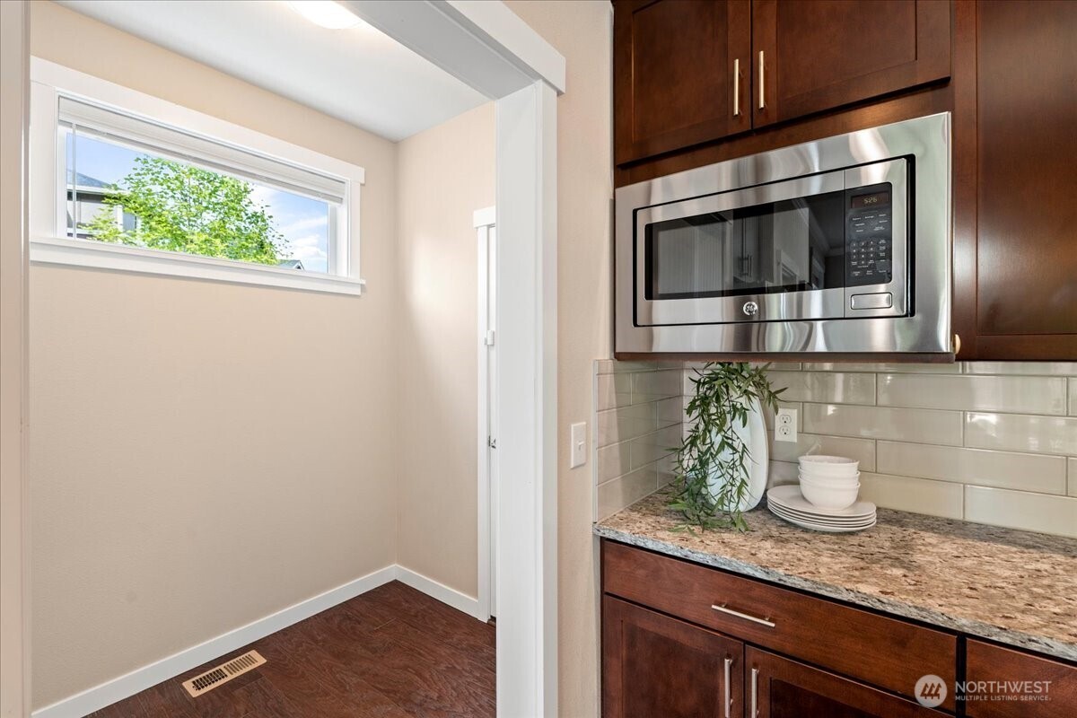 11 200th Place Southwest Bothell, WA 98012 - Photo 11 of 40 a kitchen with a sink and cabinets