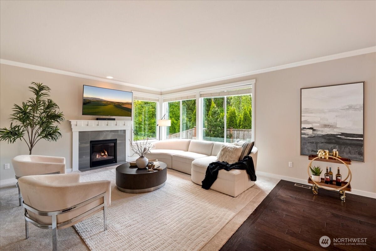 11 200th Place Southwest Bothell, WA 98012 - Photo 18 of 40 a living room with furniture a fireplace and large windows