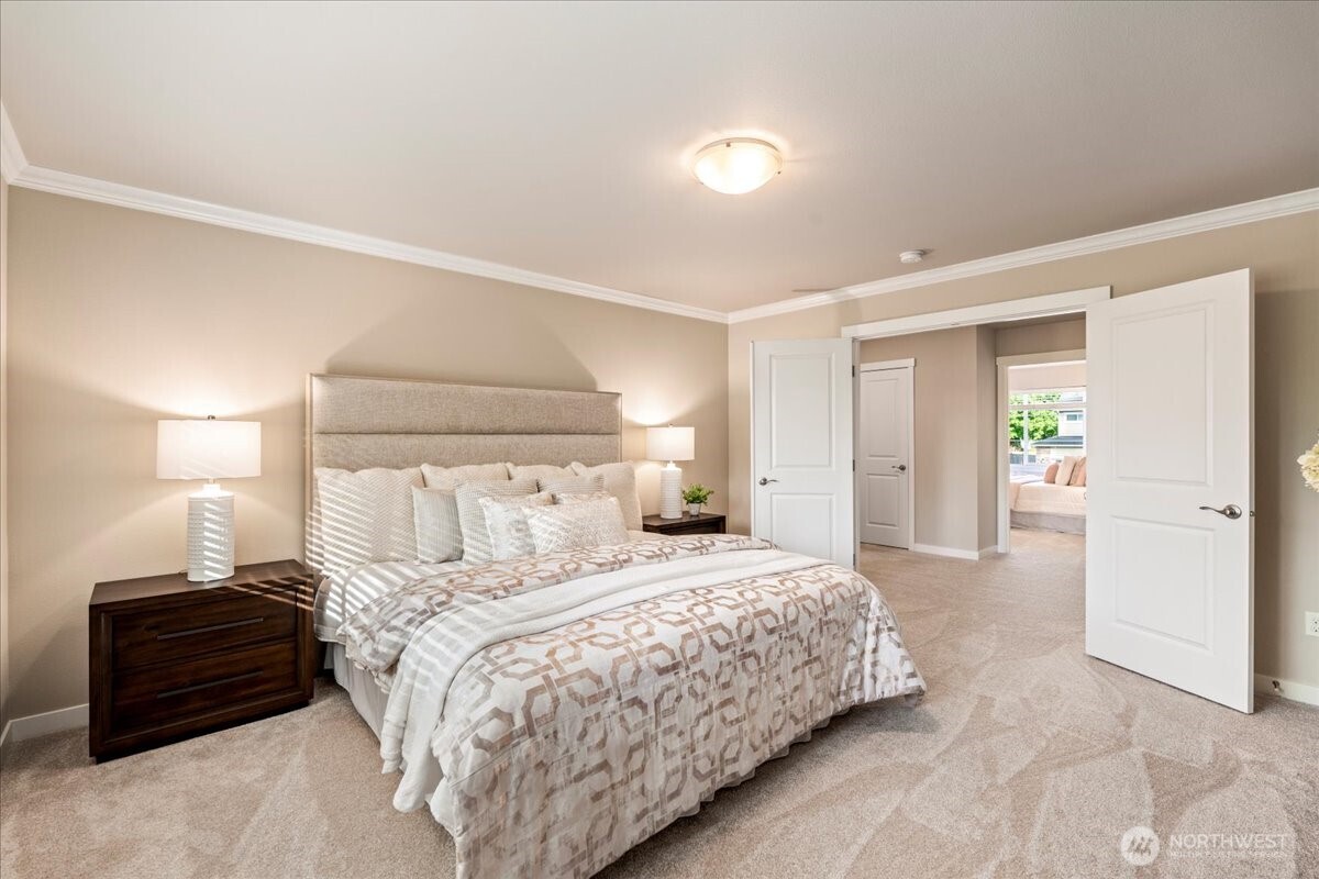 11 200th Place Southwest Bothell, WA 98012 - Photo 22 of 40 a bedroom with a bed and a lamp