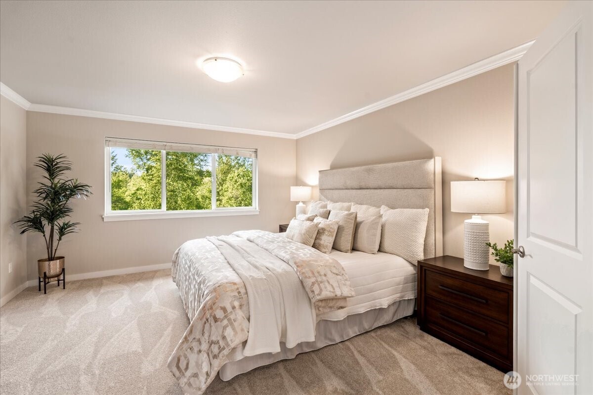 11 200th Place Southwest Bothell, WA 98012 - Photo 23 of 40 a bedroom with a large bed and a window
