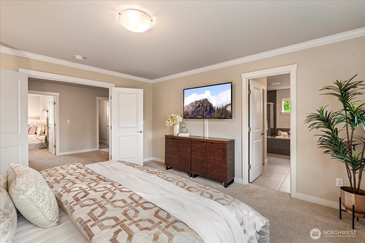 11 200th Place Southwest Bothell, WA 98012 - Photo 24 of 40 a bedroom with a bed and a flat screen tv