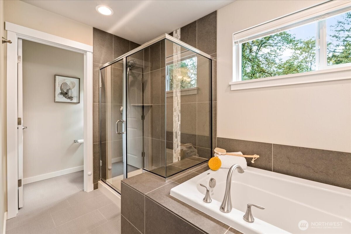 11 200th Place Southwest Bothell, WA 98012 - Photo 28 of 40 a bathroom with a tub and shower