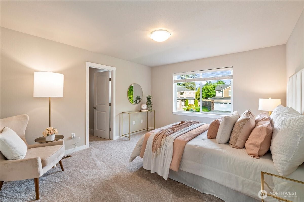 11 200th Place Southwest Bothell, WA 98012 - Photo 29 of 40 a spacious bedroom with a bed and a window