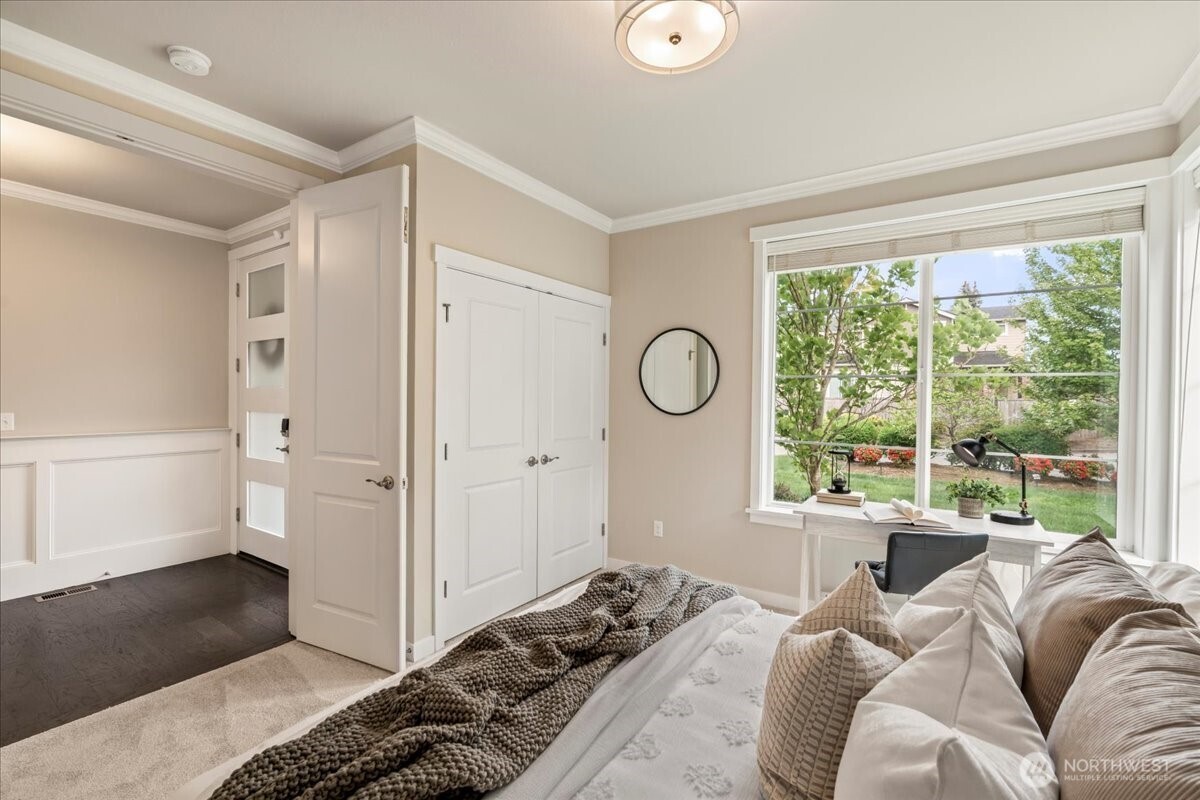 11 200th Place Southwest Bothell, WA 98012 - Photo 4 of 40 a bedroom with a bed and a large window