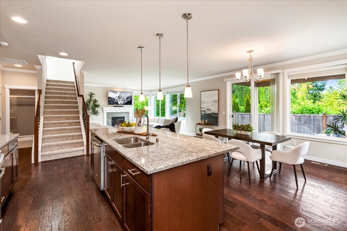 11 200th Place Southwest Bothell, WA 98012 - Photo 10 of 40 a kitchen with a table chairs stove and kitchen view