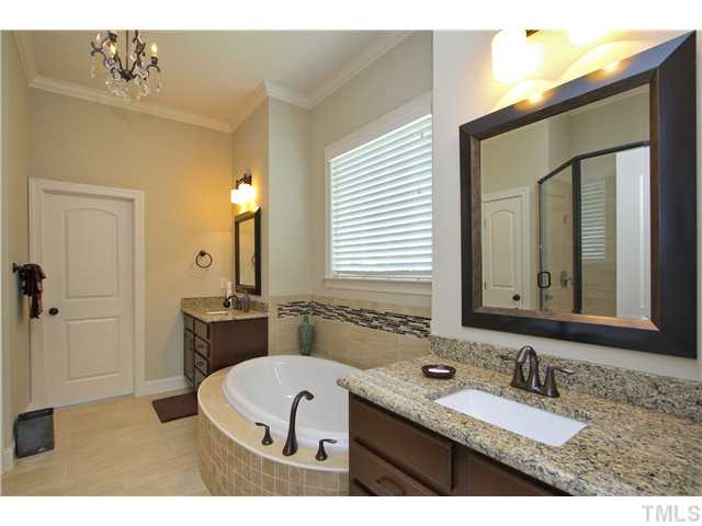7628 Pinecrest Road Raleigh, NC 27613 - Photo 20 of 25 Master Spa features his/her sinks w/ granite top, luxurious garden tub, huge walk in closet Master Bath/Spa